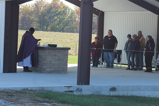 Father Augustine Okoli offers Mass at the newly-built outdoor altar on Nov. 2, All Souls Day.